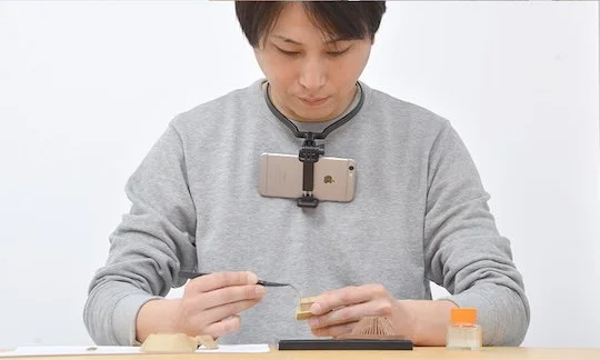 Thanko’s Smaneck is hanging phone holder for keeping hands free while filming