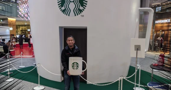 Giant, house-sized Starbucks Mug appears in Tokyo, so Mr. Sato grabs own huge mug to check it out