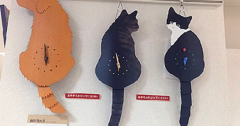 Japanese cat and dog clocks with swishing tails make clock-watching more adorable than ever