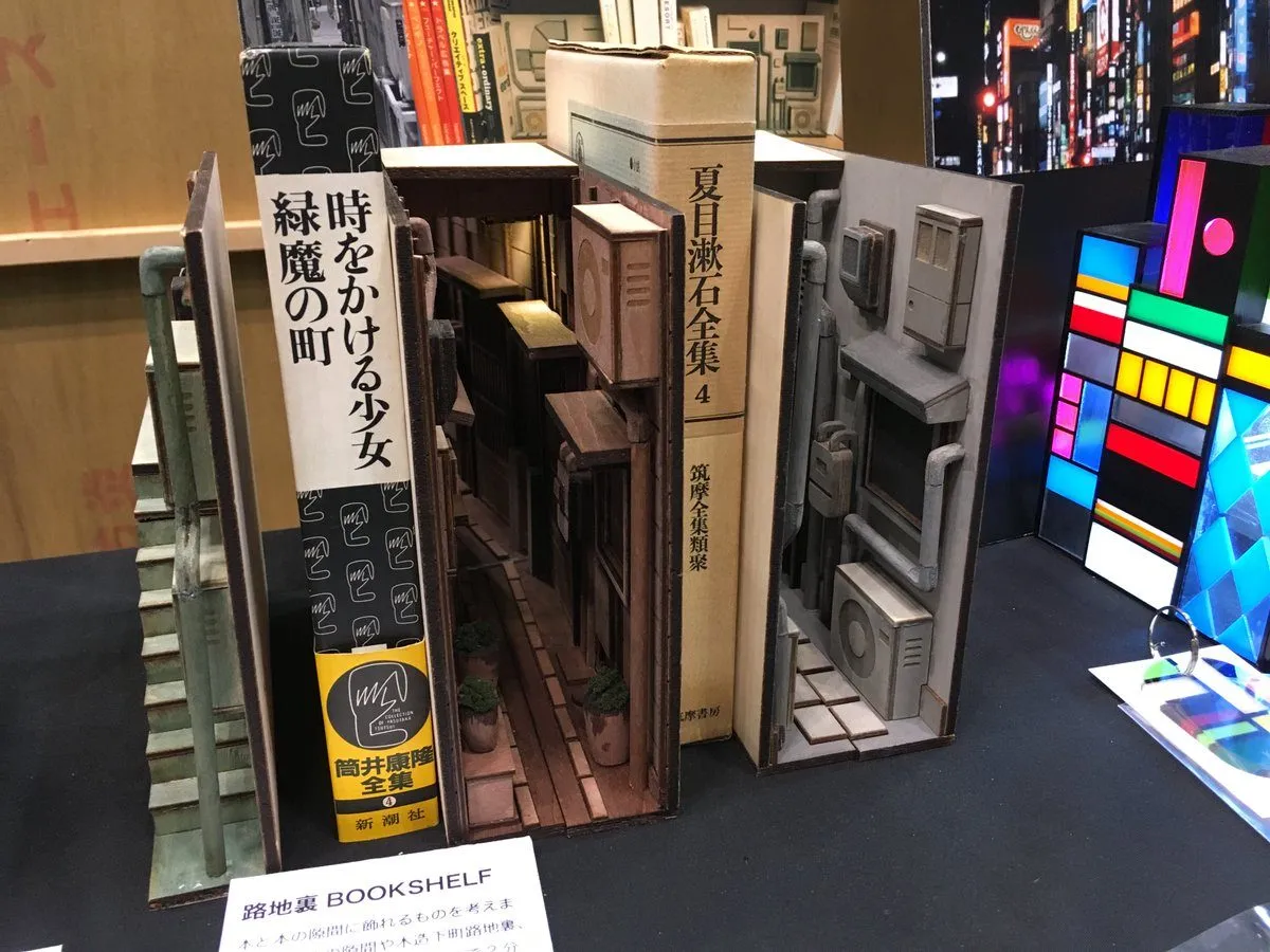Magical Bookends Transform Bookshelves into the Back Alleys of Japan