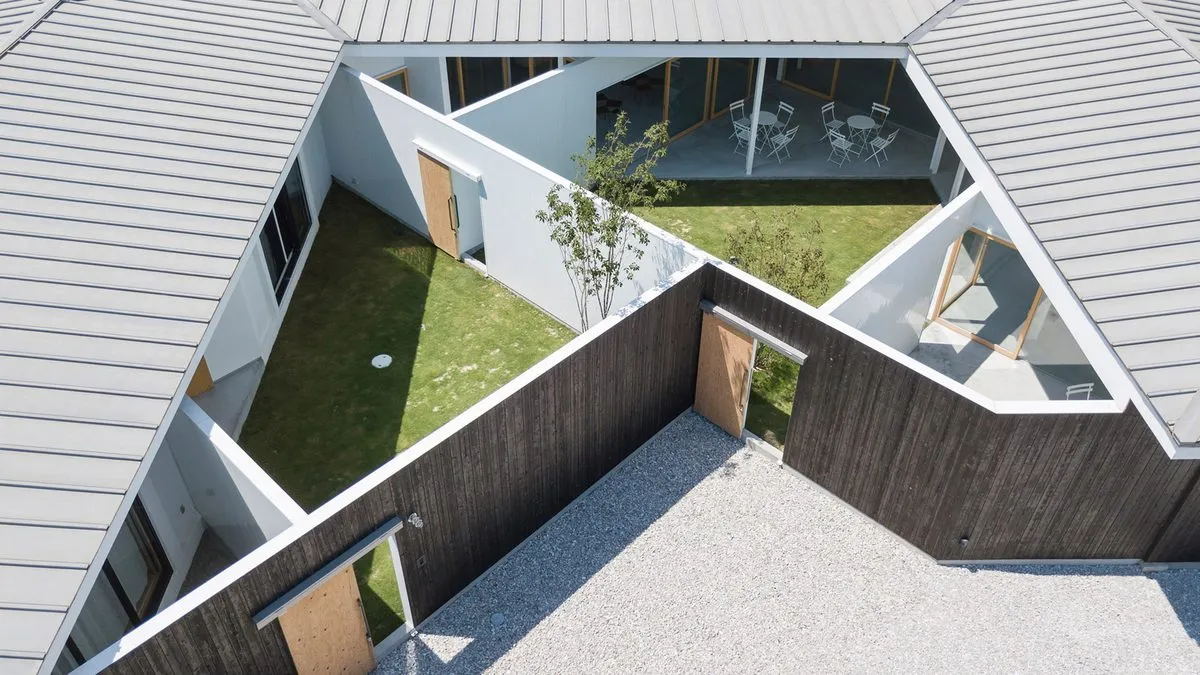 Hofu house clad in old miso barrels by Tato Architects